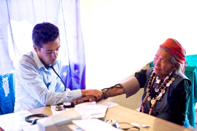 doctor checking old man